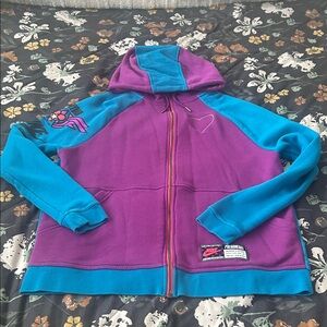 Nike Woman’s Amyiah’s Rally Vibrant Purple and Teal Jacket